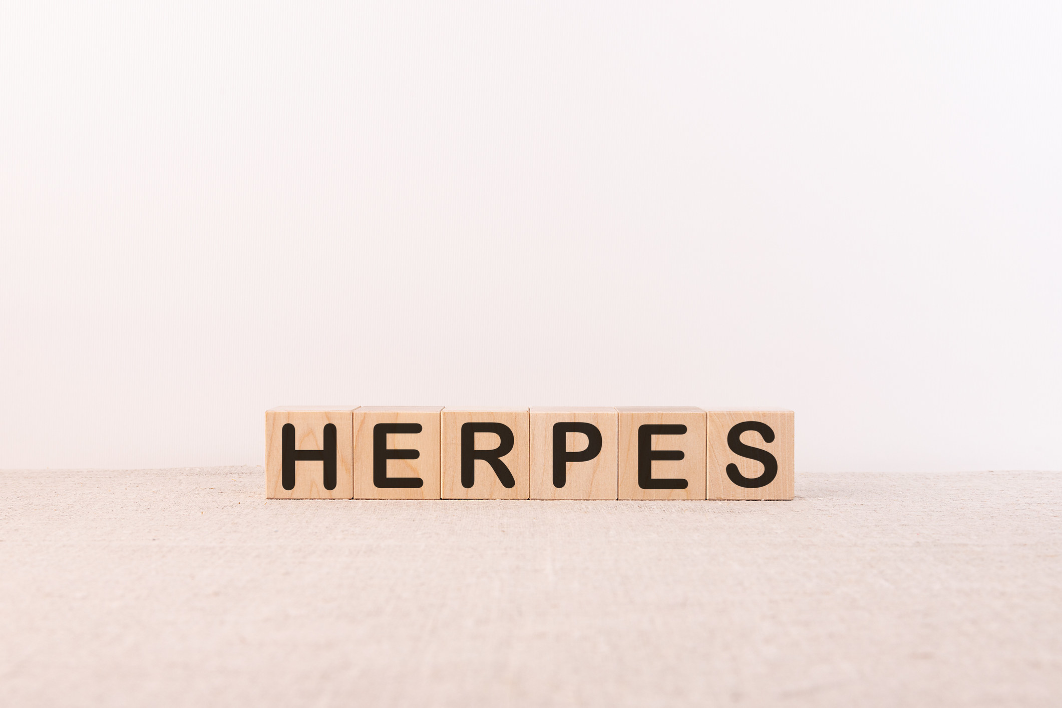 Block letters spelling out &quot;Herpes&quot;