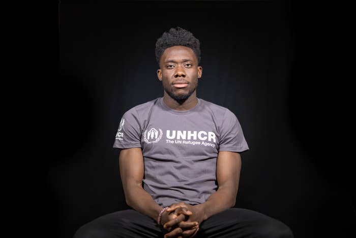 Alphonso Davies wearing a UNHCR t-shirt.