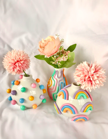 three more bud vases. From left to right, they have colorful 3D polka dots, the random lines again, and the rainbows