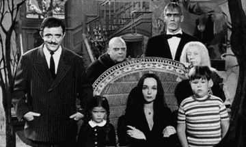 The original Addams family snapping their fingers