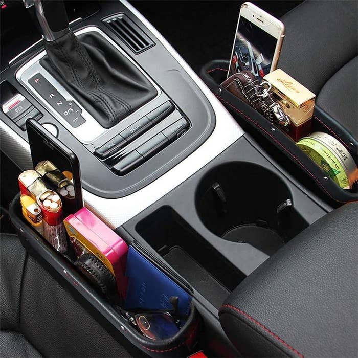 Car seat fillers containing phone, wallet, keys, lighter and cigarettes