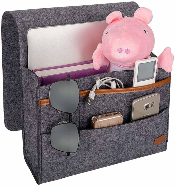 The caddy is used to store a mobile phone, power bank, tab, glasses, charging cable, AC remote, and more