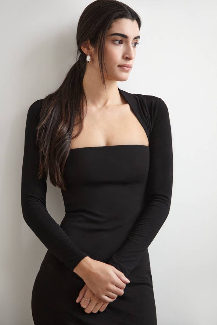 model wearing the long-sleeved bolero in black