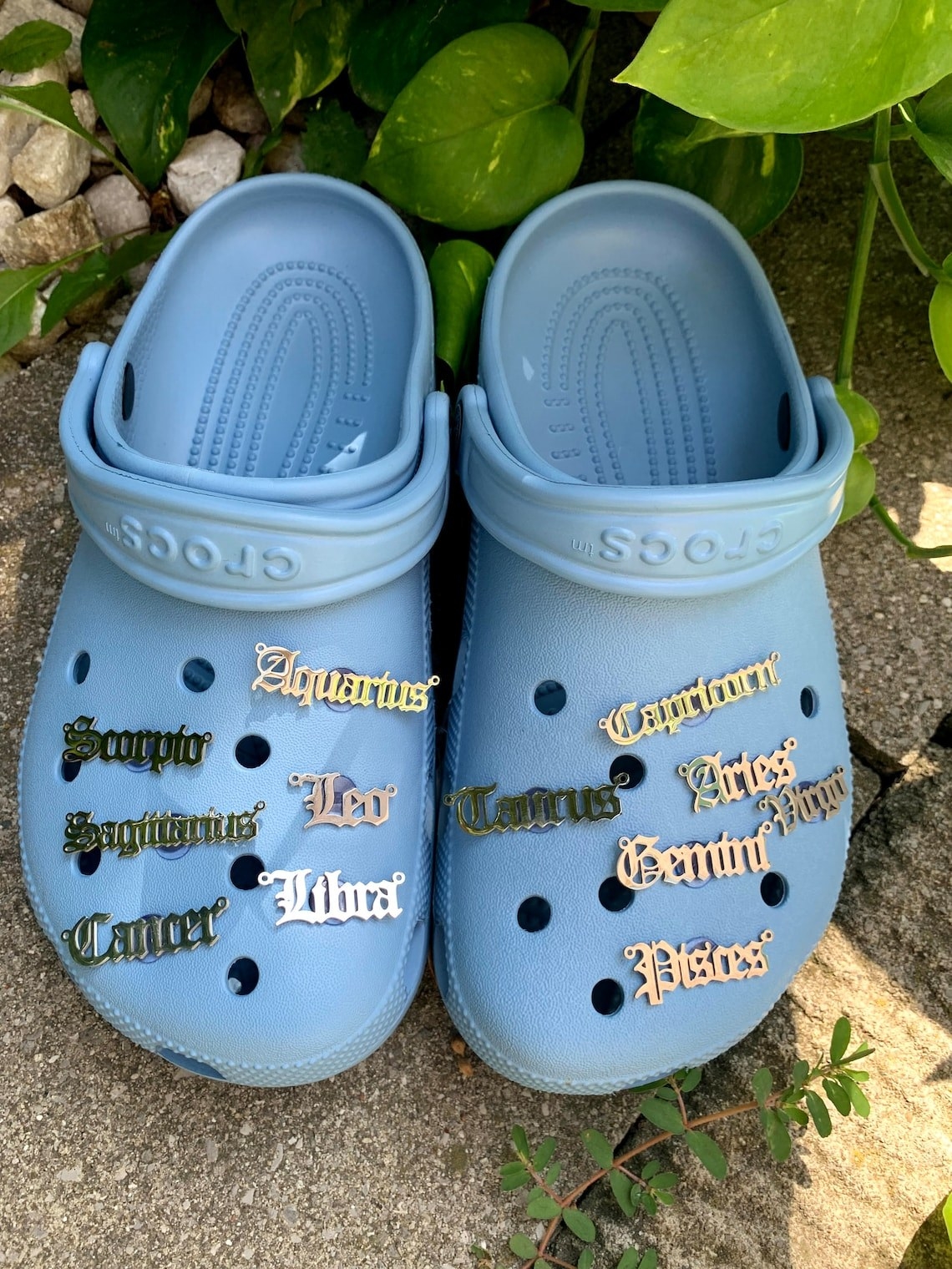 Several charms on a pair of Crocs