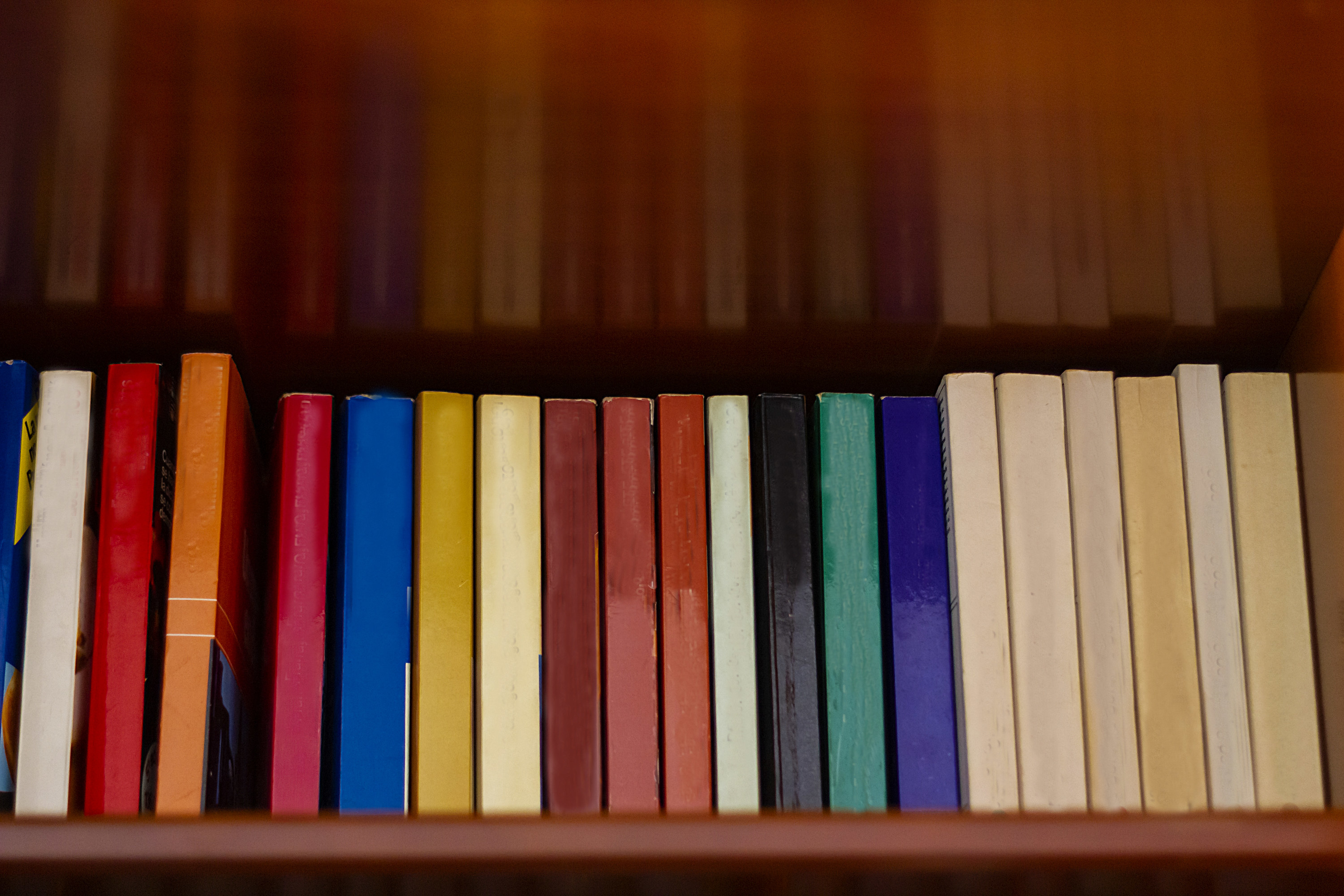 Bookshelf full of books of different colors