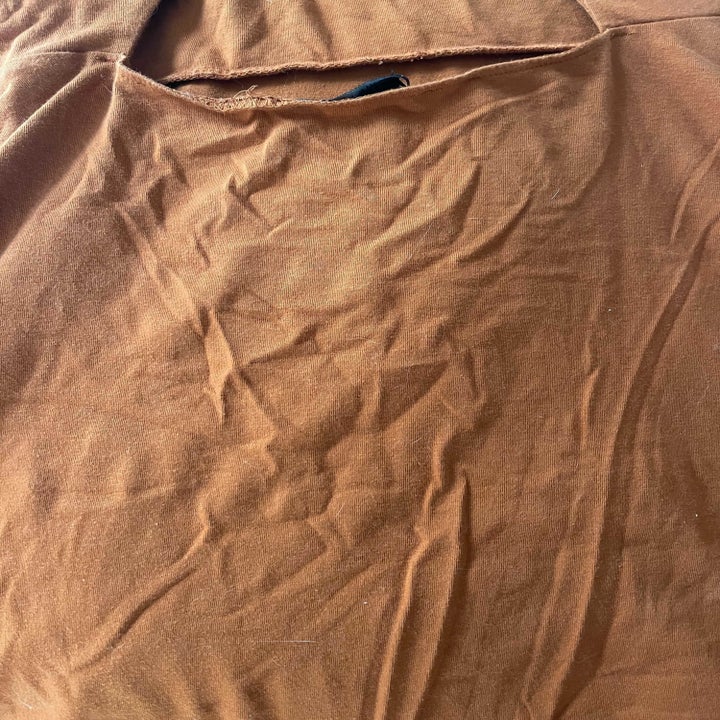 An orange dress with wrinkles