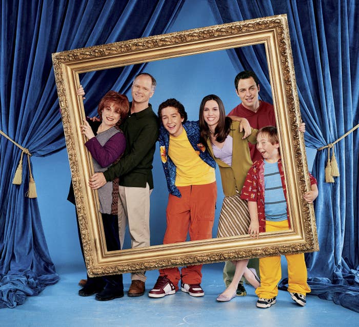 A promotional photo featuring the family from Even Stevens holding up an oversized picture frame