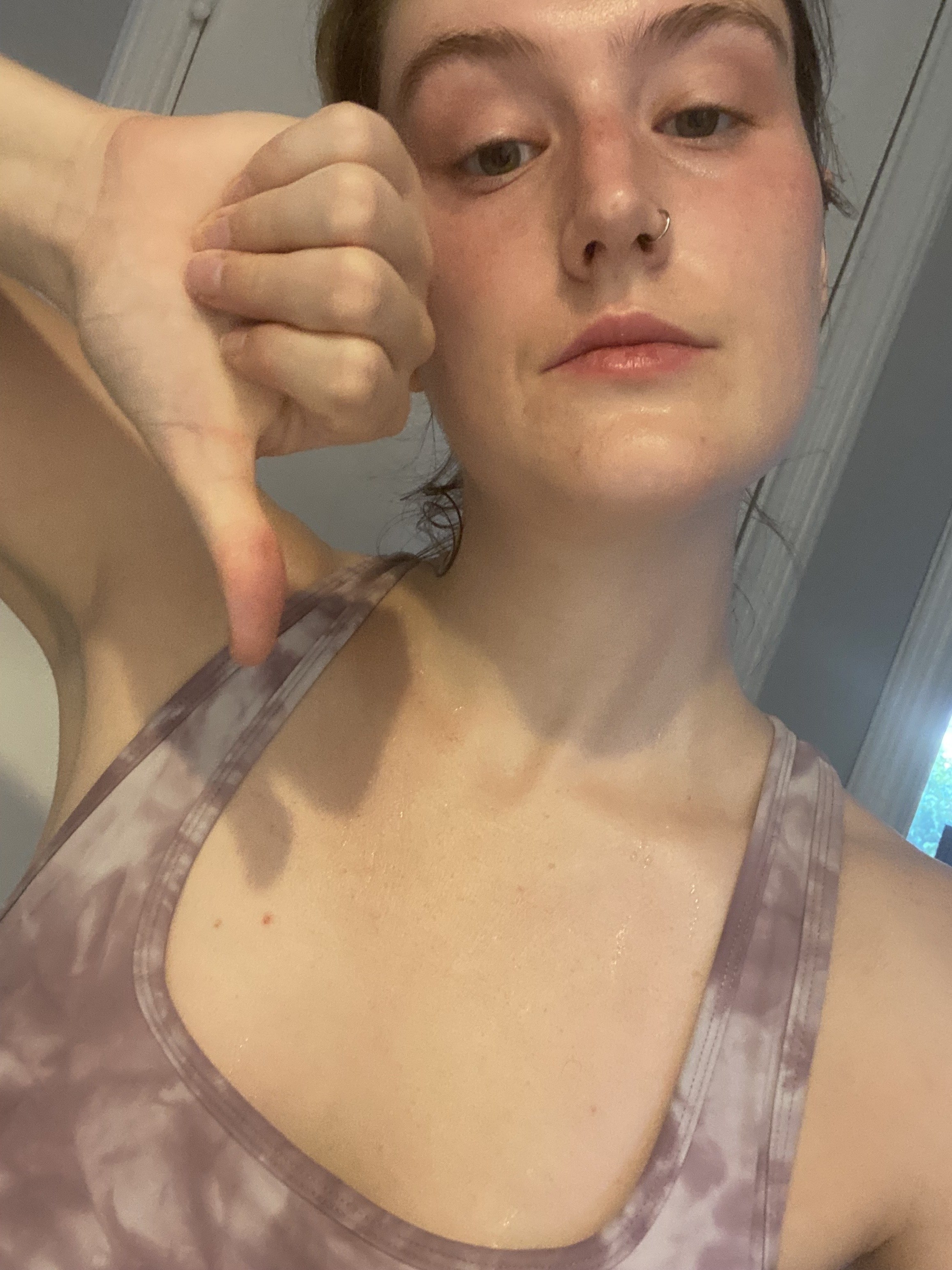 Me, sweaty and tired after my run and giving a thumbs down