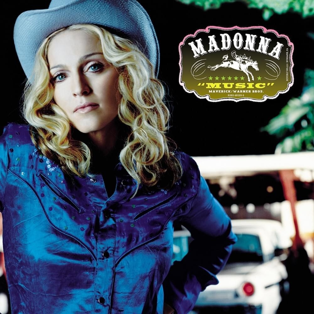 madonna in a cowboy hat and silk shirt