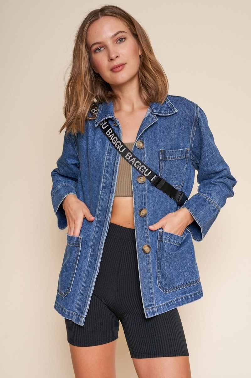 model wearing the blue denim jacket