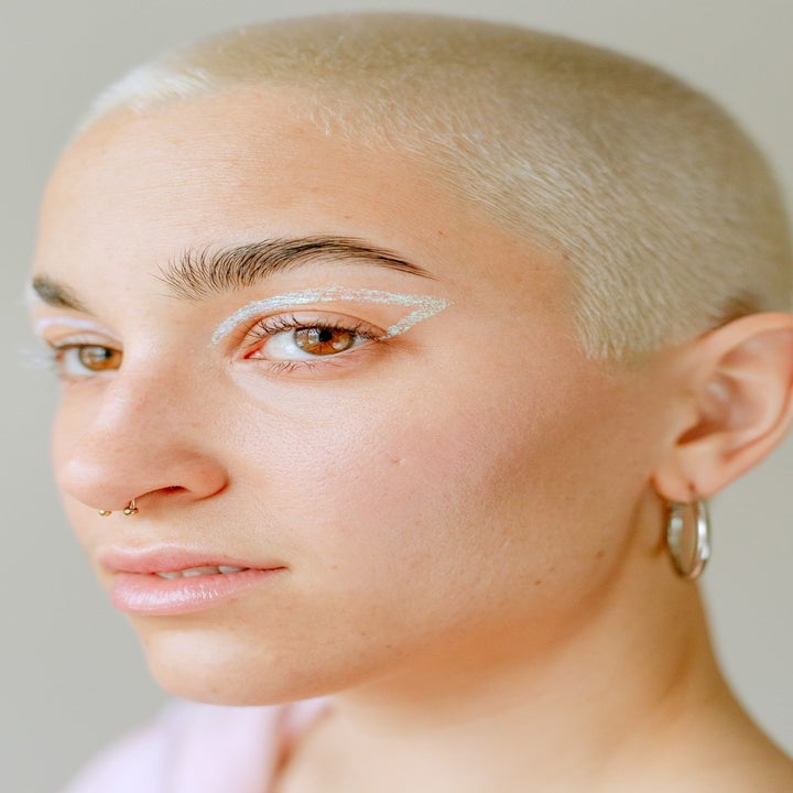 model wearing glittery eyeliner around their eye