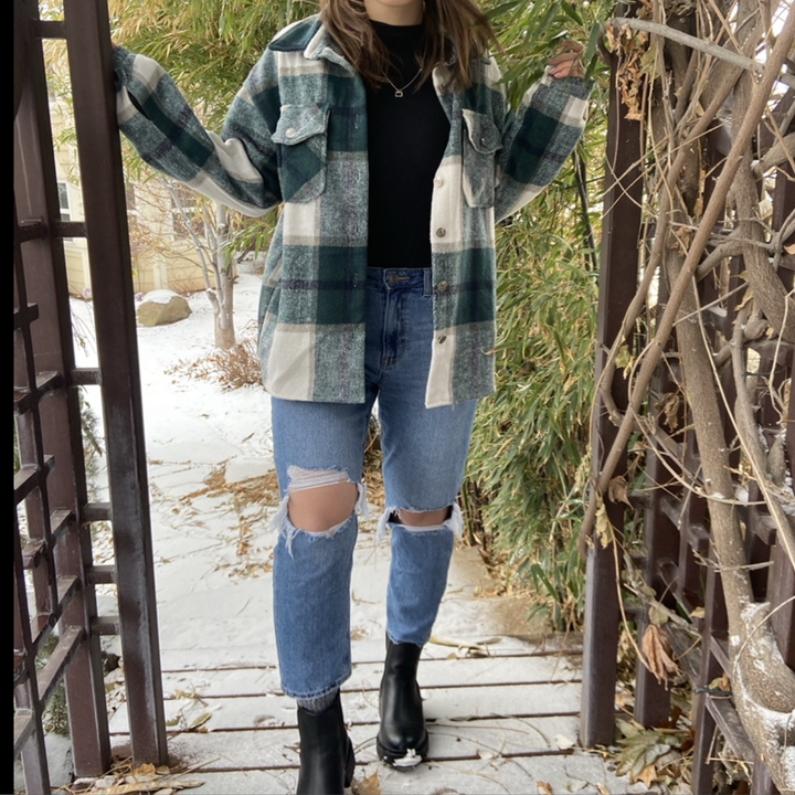 Reviewer in thick blue and white plaid button up shirt