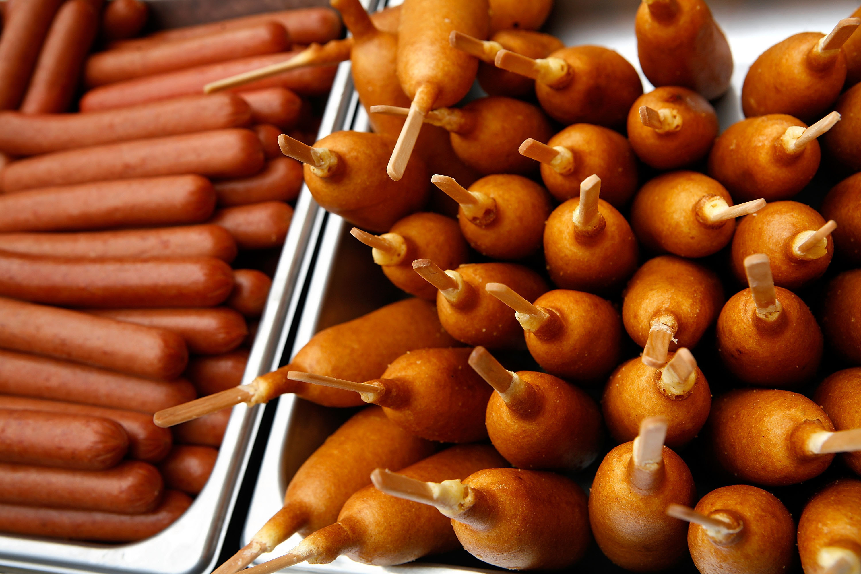 Close up view of corndogs and hot dog sausages