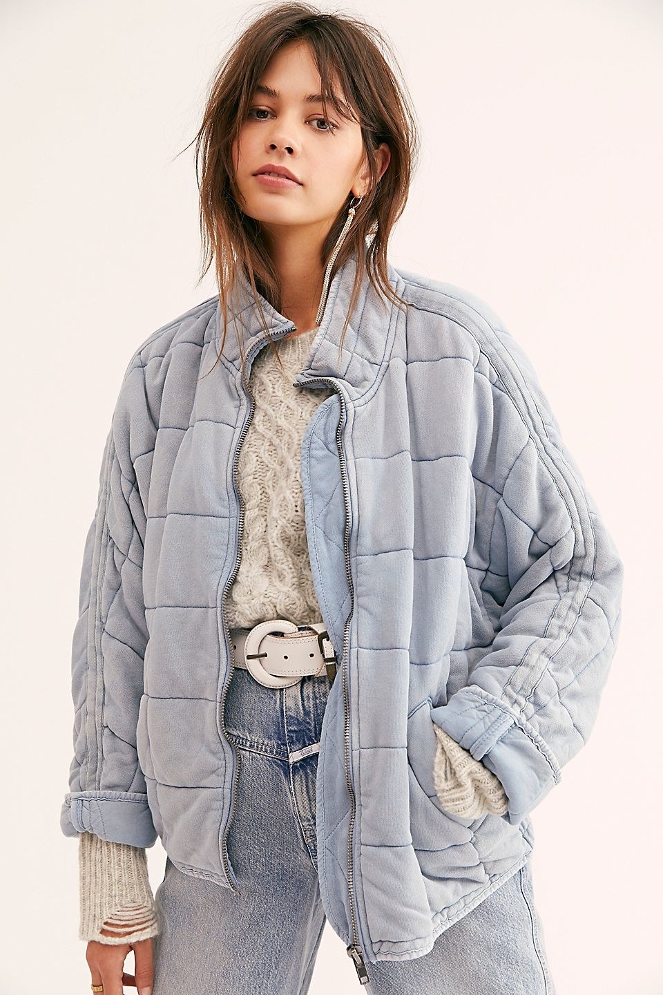 model wearing the quilted jacket in light blue