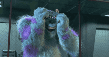 a gif of sully from monster&#x27;s inc stressed and falling to the floor
