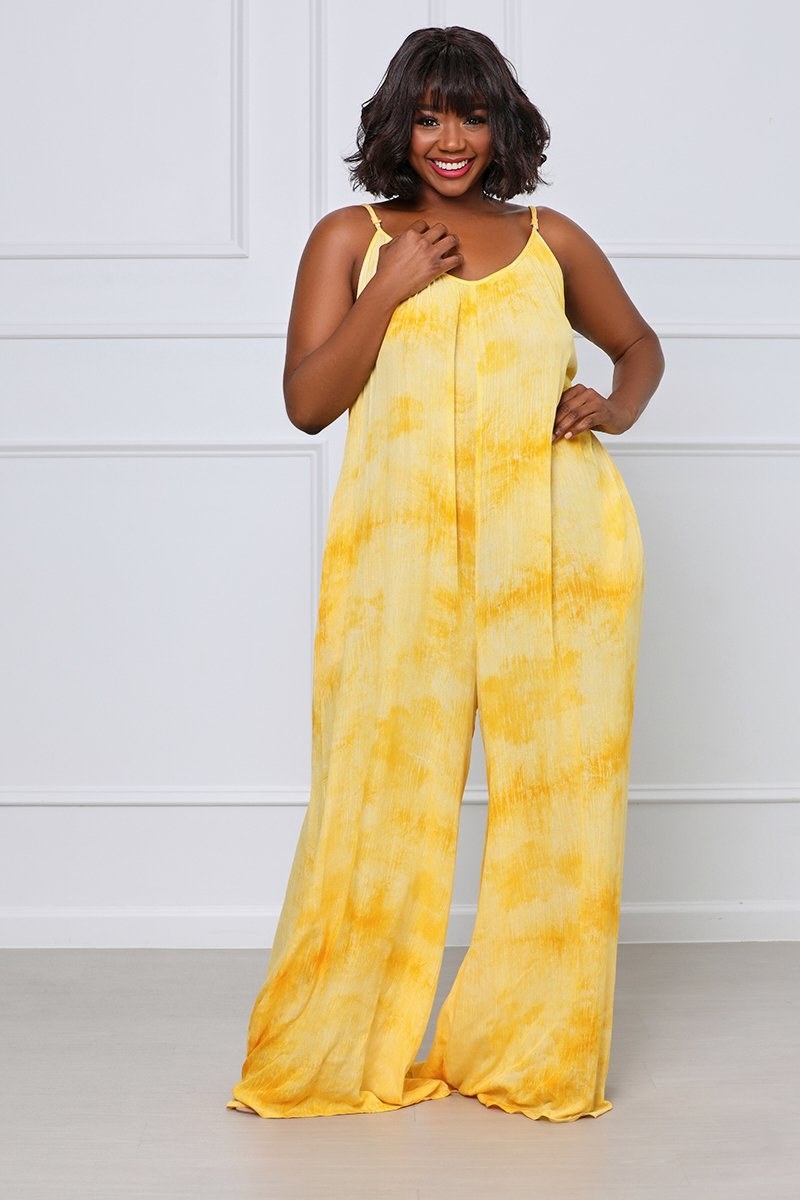 Model in pant-legged yellow and white sleeveless jumpsuit