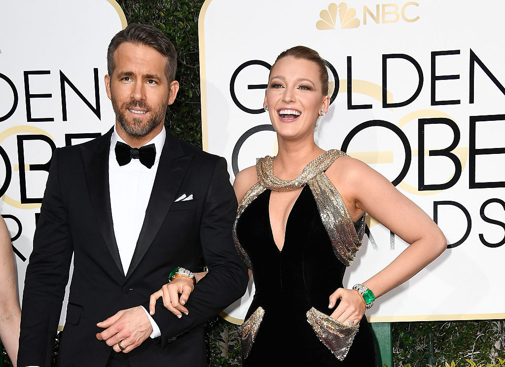 Ryan Reynolds (L) and Blake Lively on the 74th Annual Golden Globe Awards red carpet