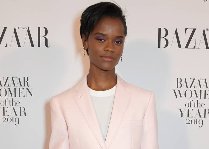 Letitia wears a pink blazer with a white T-shirt