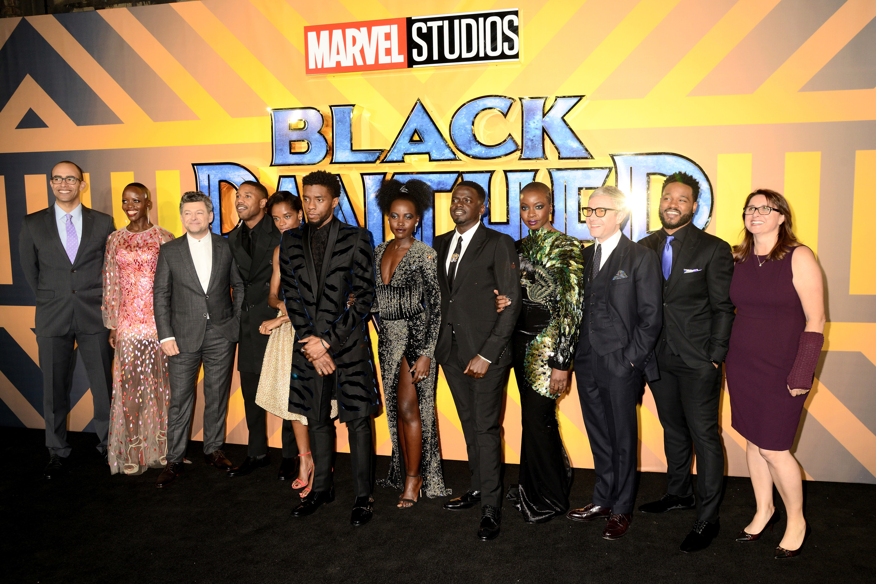 The entire cast poses on the Black Panther red carpet
