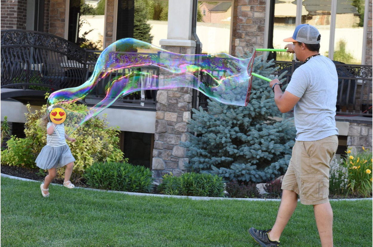 A reviewer blowing a giant bubble