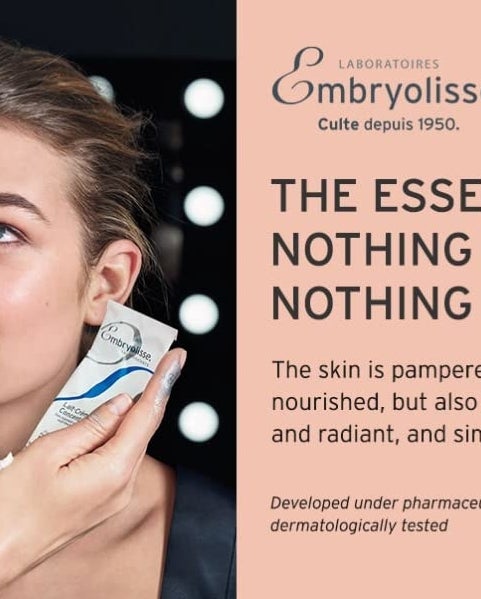 Model applying Embryolisse Lait-Crème Concentré to other model&#x27;s face