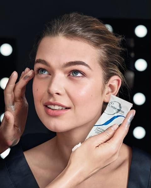 Model applying Embryolisse Lait-Crème Concentré to other model&#x27;s face