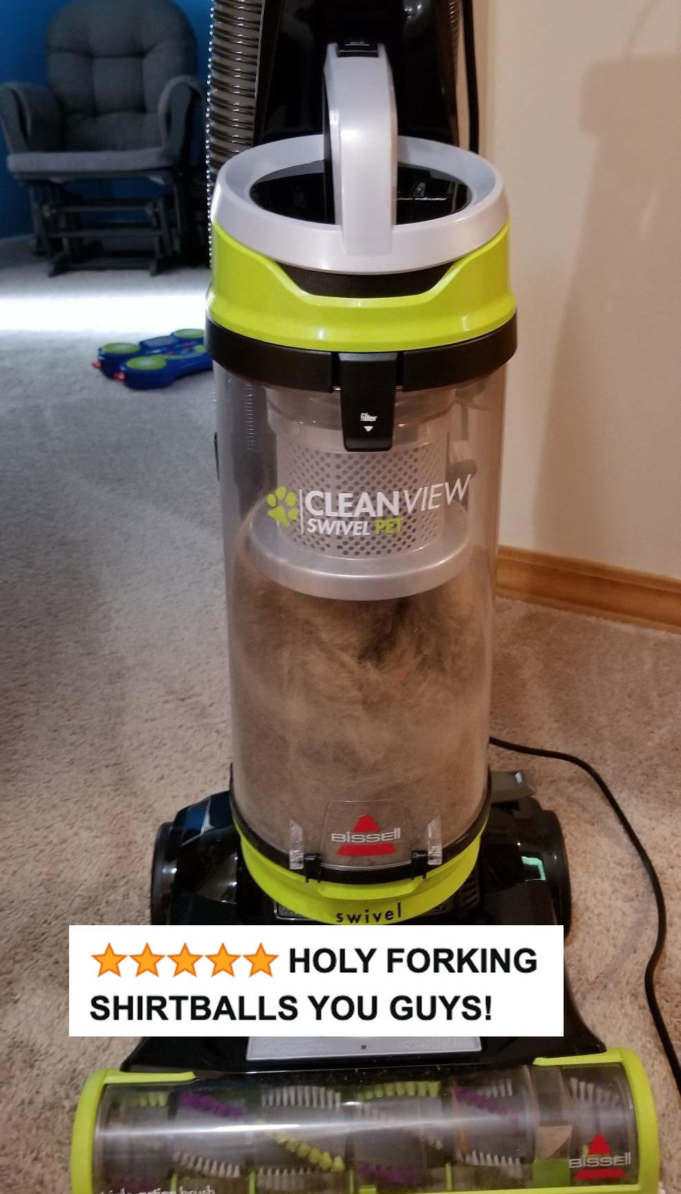 The vacuum filled with pet hair and dust with five stars and review text &quot;holy forking shirtballs you guys!&quot;