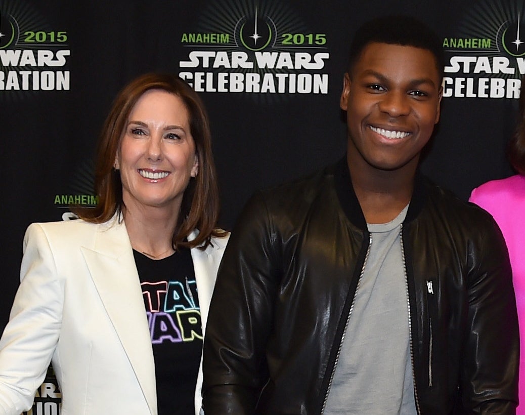 John stands next to Kathleen at an event