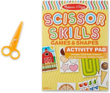 A pair of yellow scissors and an activity pad