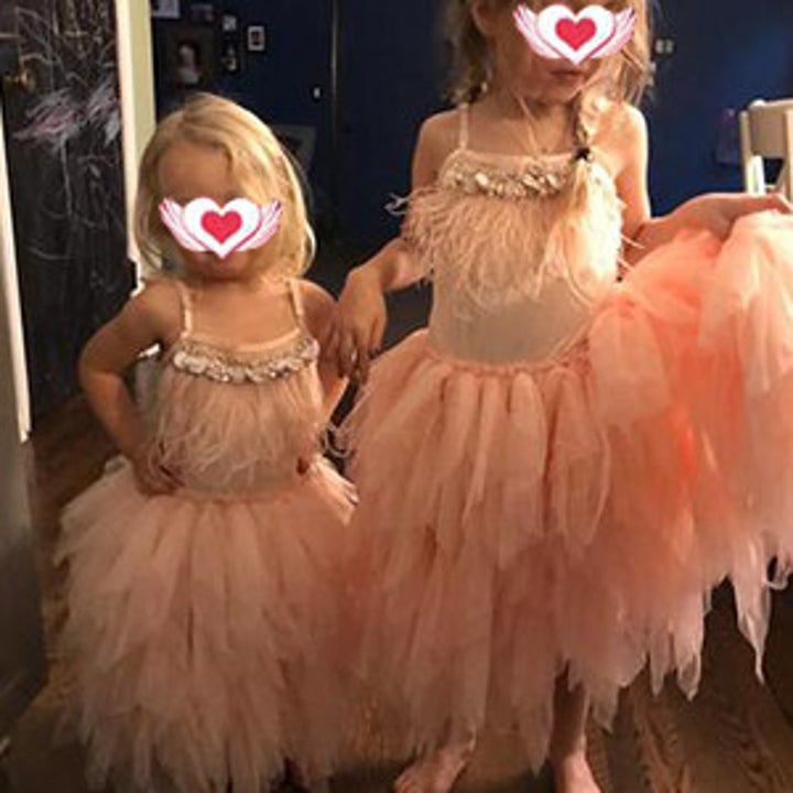 Reviewer's photo showing two children wearing the dusty pink tutu dresses