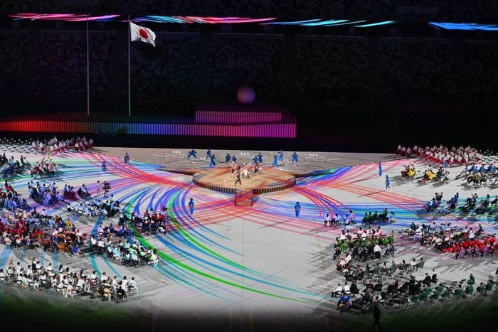 Performers and delegations take part in the opening ceremony for the Tokyo 2020 Paralympic Games at the Olympic Stadium in Tokyo