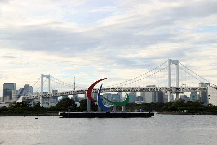 A general view of the &#x27;Three Agitos&#x27; Paralympic Symbol is seen in front of the Rainbow Bridge at Odaiba Marine Park