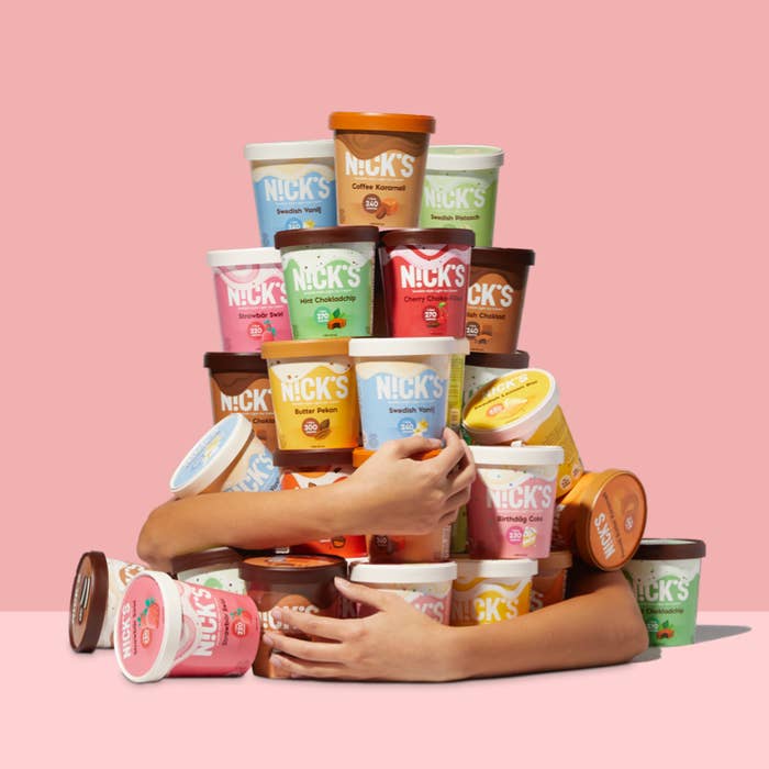 arms around a bunch of pints of ice cream