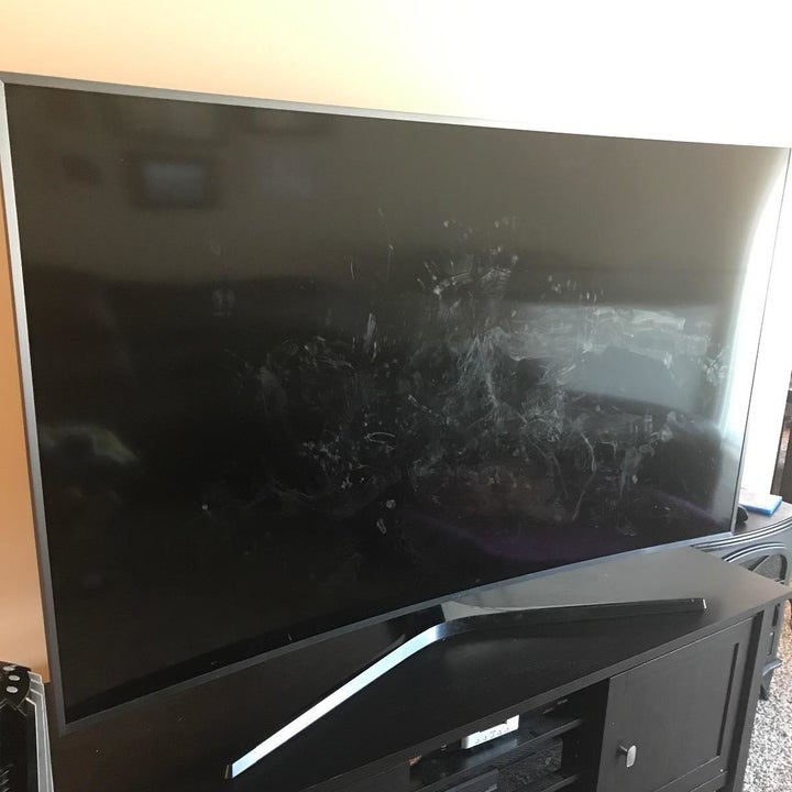 a reviewer photo of a TV with smudges across the screen 
