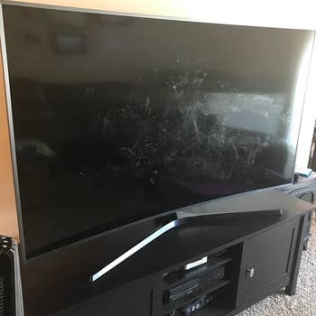 a reviewer photo of a TV with smudges across the screen 