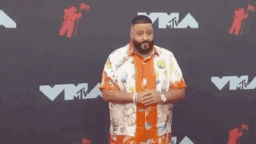 DJ Khaled giving the peace sign on the MTV VMAs red carpet