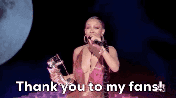 Doja Cat thanking her fans on stage for winning an MTV VMA