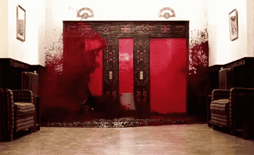 GIF of elevator from the Shining opening up and blood pouring down the hallway