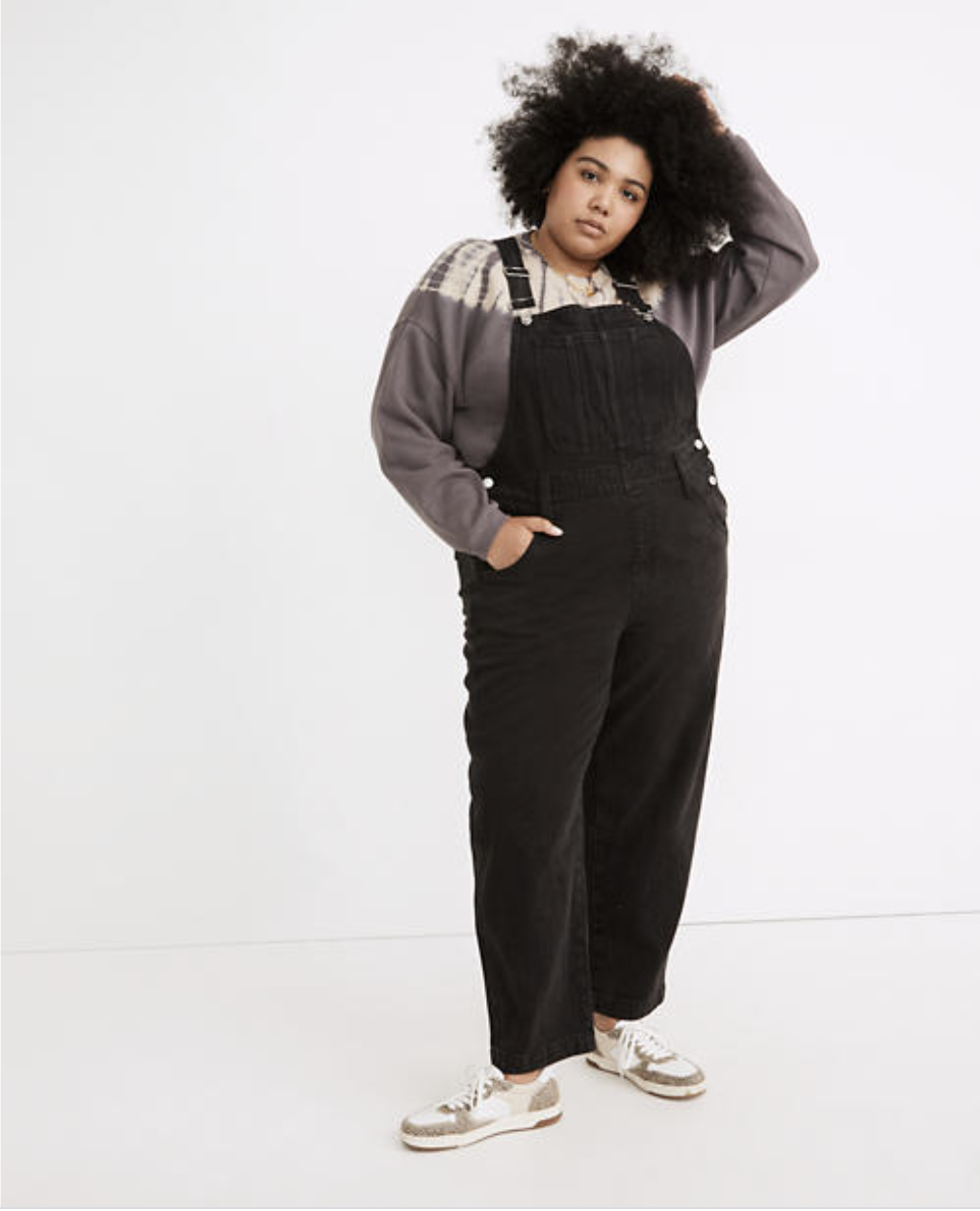 Model in a pair of black overalls