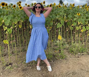 another reviewer wearing the dress in a sunflower field with white oxfords