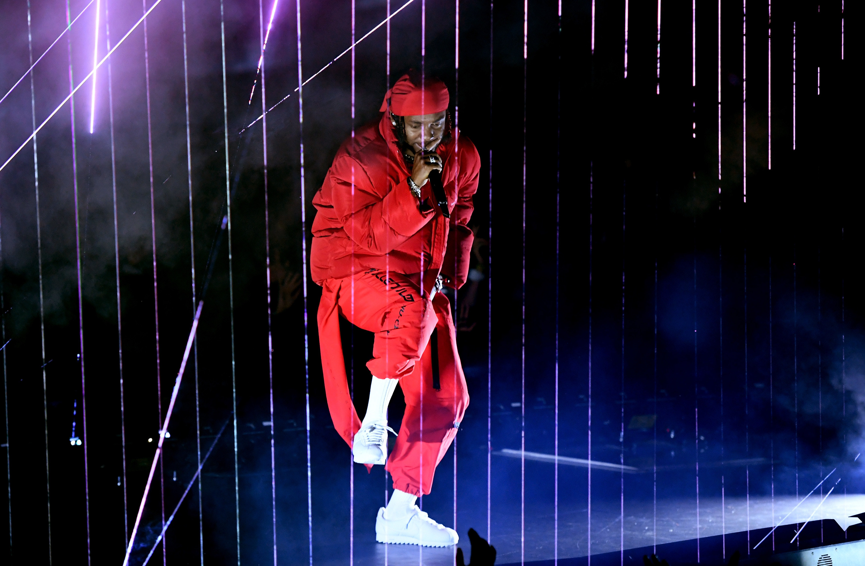 Kendrick Lamar performs onstage surrounded by lazor beams during the 2017 MTV Video Music Awards at The Forum on August 27, 2017 in Inglewood, California.