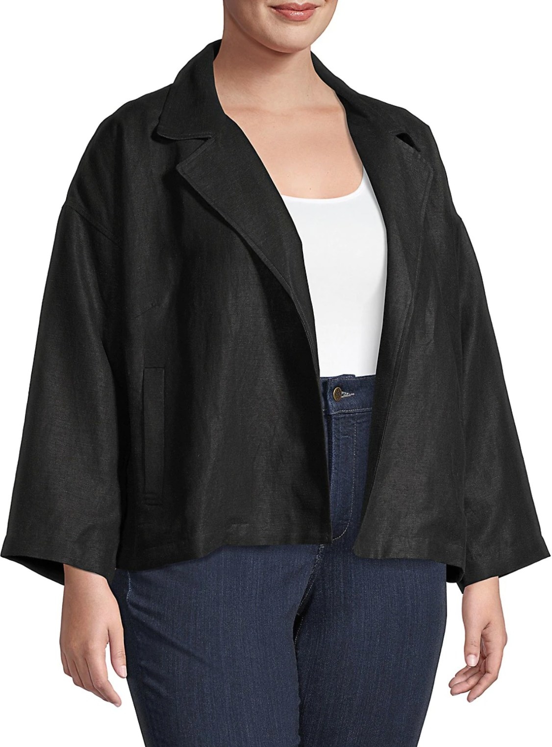 model wearing the jacket in black with a white top and blue jeans