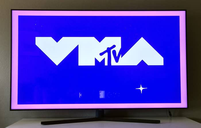 An illustration of the MTV VMAs logo on a bright blue background