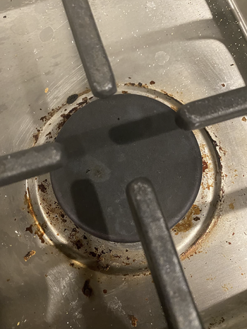 Reviewer image of caked on stain on a stove top 