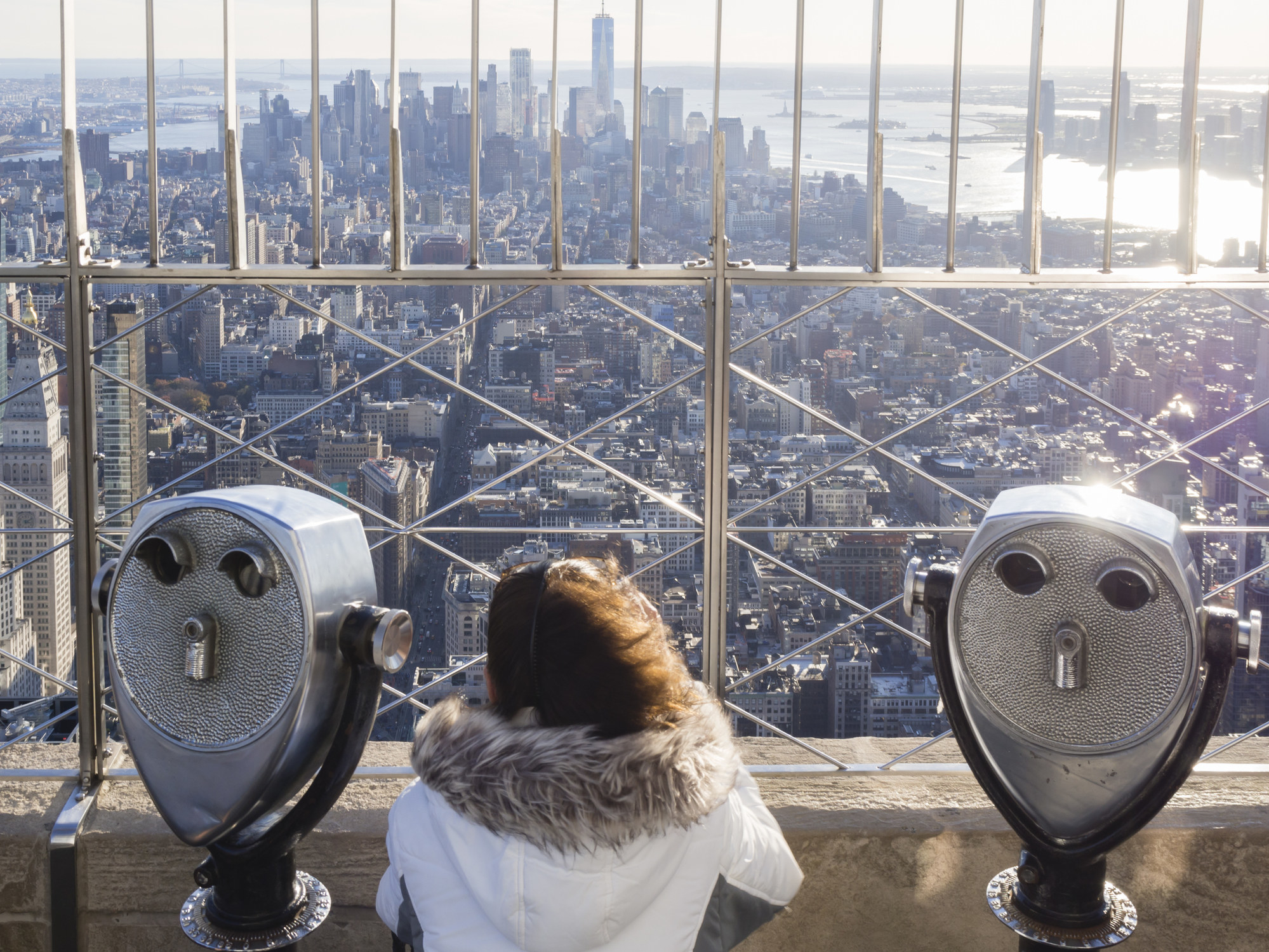 A tourist on the top of the Empire State Building.