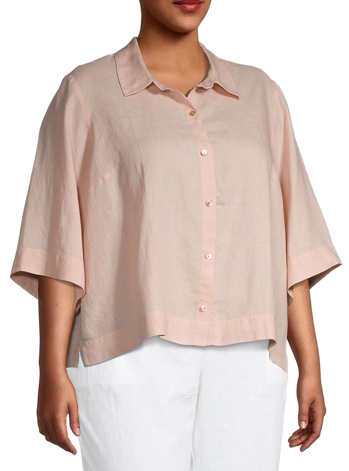 model wearing the light pink button down with white pants