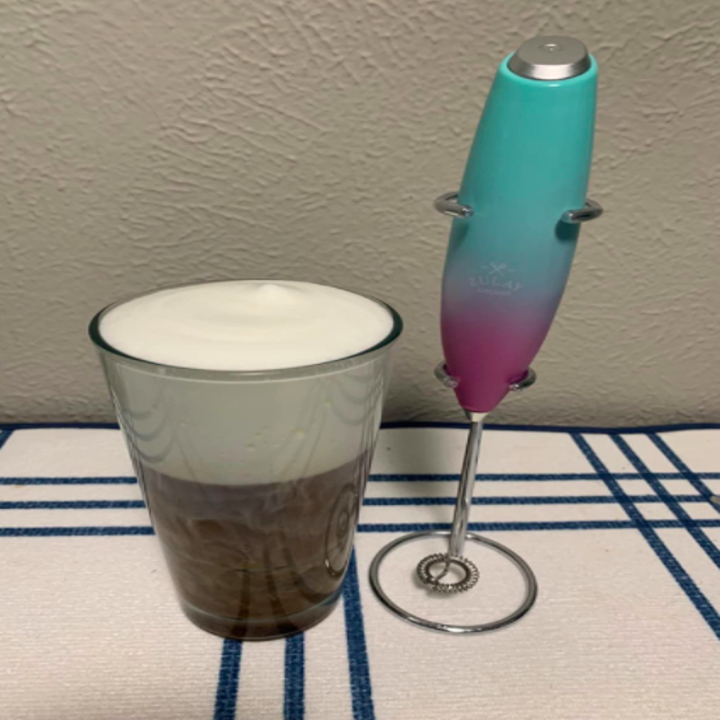 a reviewer's photo of the pink and blue milk frother