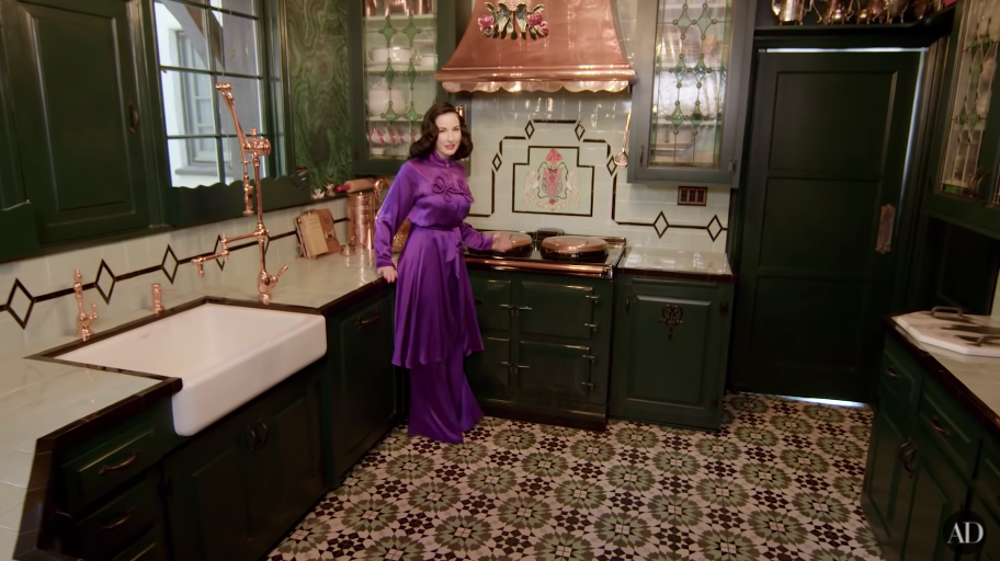 Dita standing in her kitchen