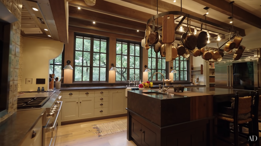 Jared and Genevieve Padalecki&#x27;s large rustic, beige and brown kitchen