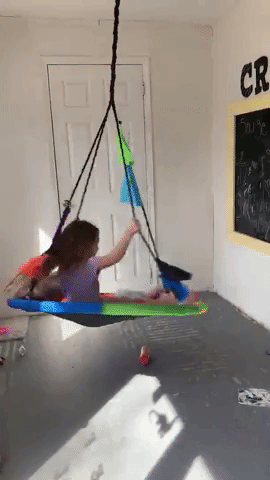 Reviewer's kids swinging in the room